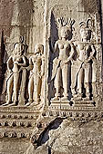 Angkor Wat temple, second enclosure, devatas sculpted in bas-relief with an extraordinary variety of intricate hair styles and costumes.